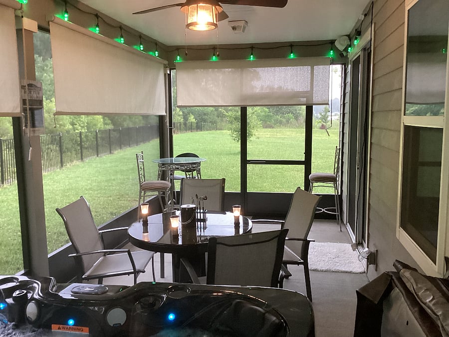 SCREENED PATIO - View of patio chairs, table, patio screen blinds, back garden and back forest.