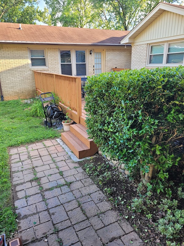 Viewed from designated parking space under carport--just a few steps across deck to private entrance.