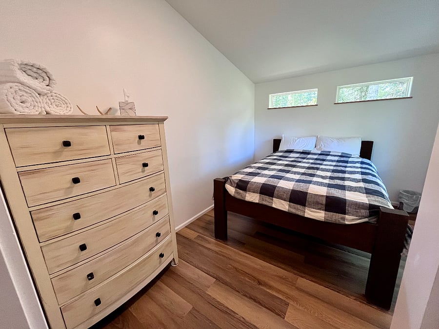 The bedroom provides a cozy reprieve for a restful sleep on a comfortable queen sized bed. Flannel sheet sets and a down comforter available for the cold sleepers. ***Blackout curtains available for the Midnight Sun***