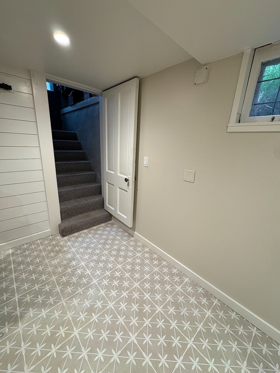 staircase entrance directly to unit from back door of house