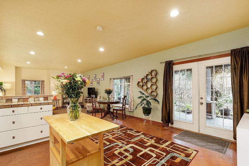 Bright natural light from oversized windows and French doors, perfect for uplifting days off. Room-darkening curtains let you create a restful, sleep-friendly space for post-shift recovery.