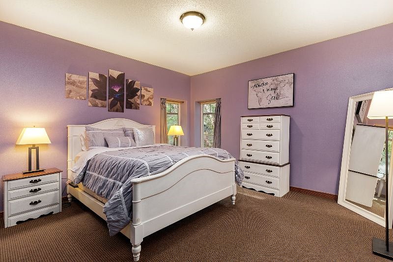 Peaceful bedroom with a supportive queen mattress and optional 4" foam topper for softer sleep. Full room-darkening curtains and extra bedding ensure deep, restorative rest between shifts.