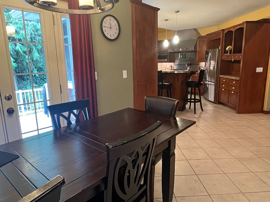 Shared dining room table and gourmet kitchen offers plenty of room for food storage and preparation.