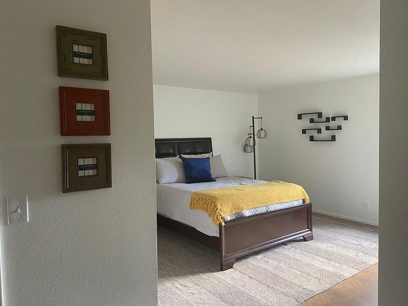 Primary bedroom king size bed