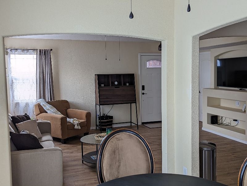 Living room/Entry door from dining room corner