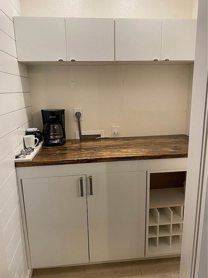 Built in bar behind barnyard doors