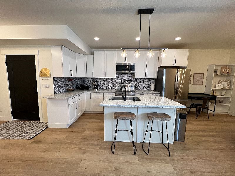 Island and barstools for extra seating.