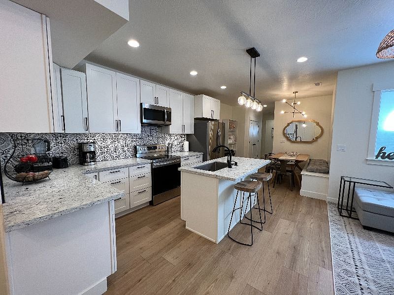 Island & 2 barstools + under cabinet lighting. 