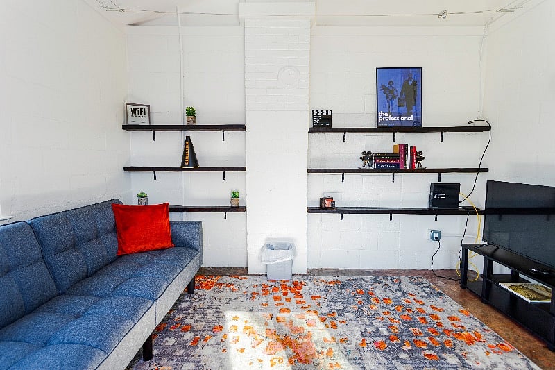 Living room with comfortable couch that converts into sofa bed.