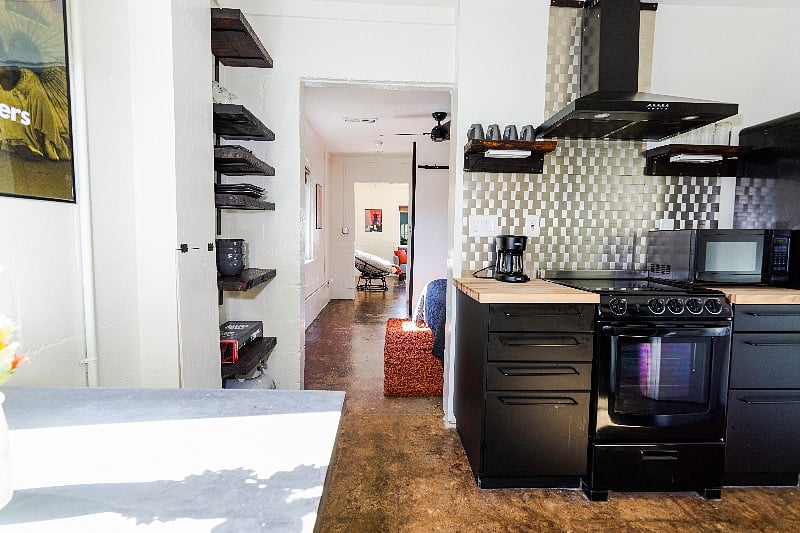 Full kitchen and appliances, fully stocked for cooking and baking.