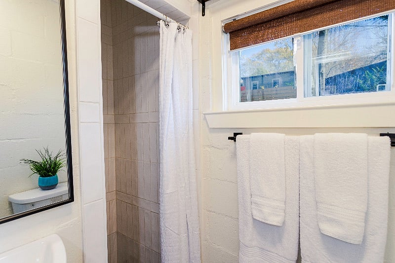 Bathroom with natural lighting and walk-in shower.