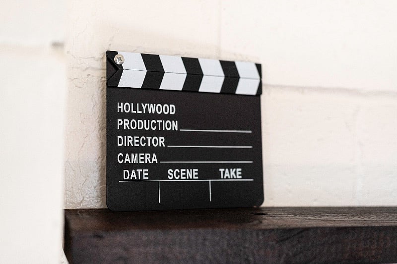 Director's slate on the bookshelf in the living room. Action!
