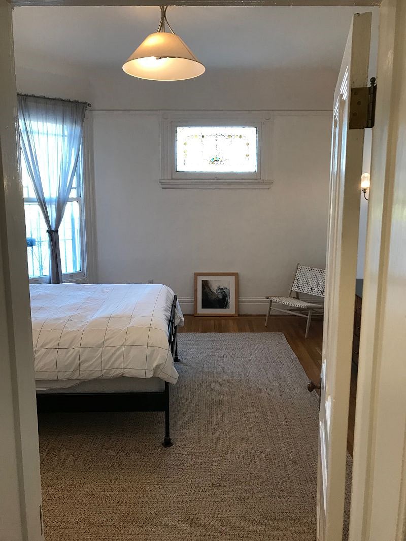 Large, well-lit bedroom with new linens, ample storage, and big closet