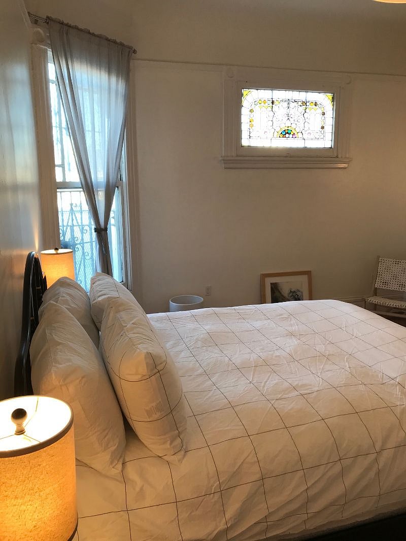 Large, well-lit bedroom with new linens, ample storage, and big closet