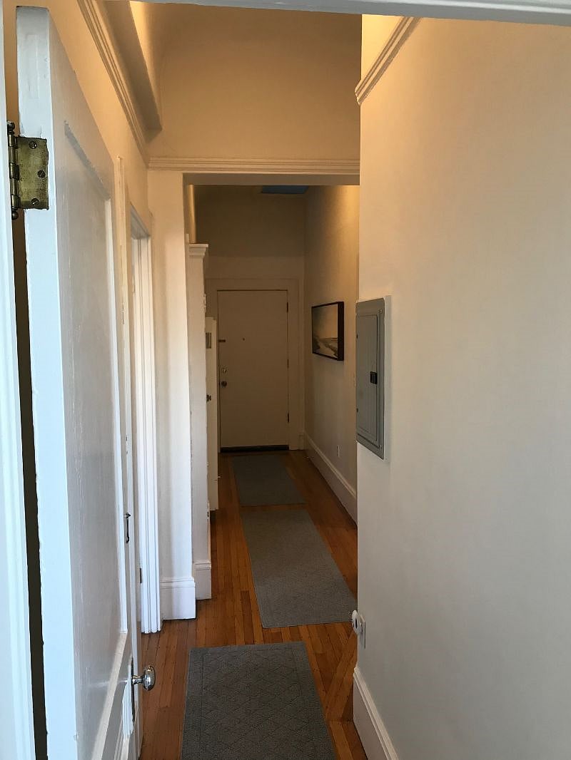 View from bathroom looking back toward front door