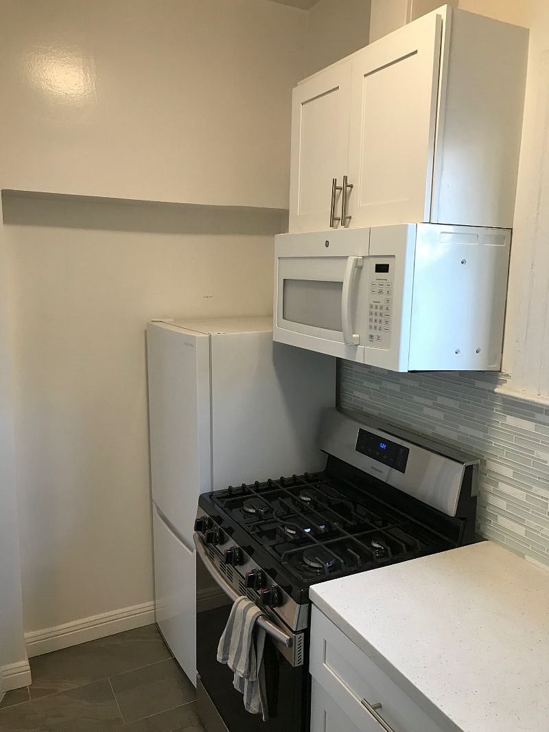 Galley-style full kitchen with dishes