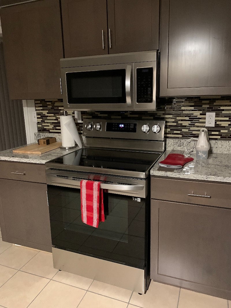 The kitchen includes dishes, silverware, glassware, wine glasses. It also includes are pots and pans, baking sheets and more. This kitchen features Stainless Steel Appliances