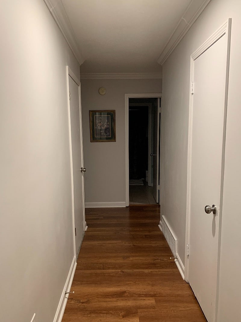 The hall way to the main bathroom tub/shower combination.
