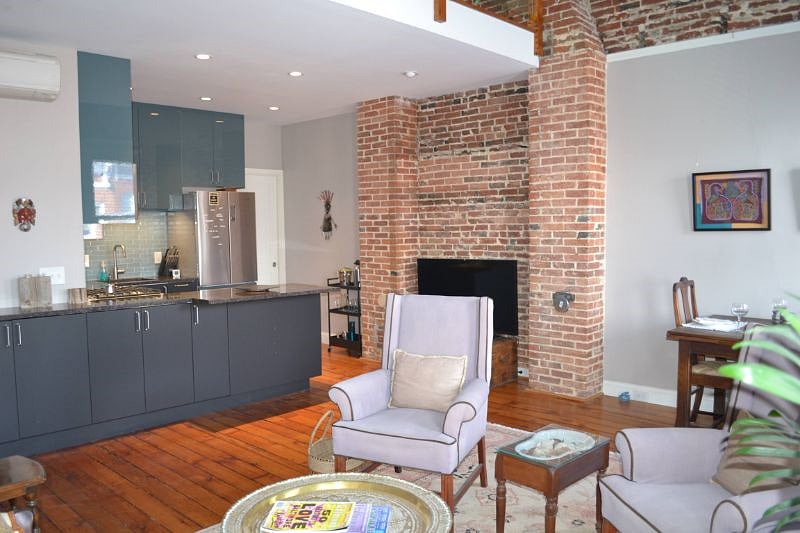 From comfy couch, kitchen and door to bathroom