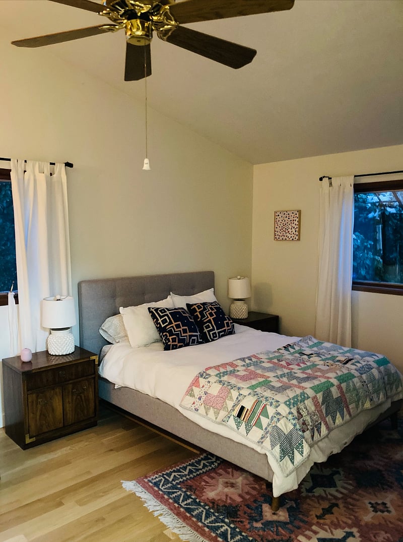 main large bedroom with queen size bed, three closets and dresser
