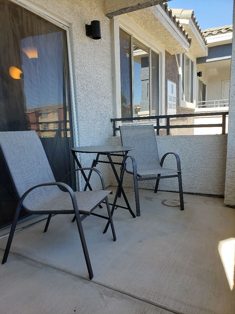 PRIVATE BALCONY WITH CHAIRS AND TABLE