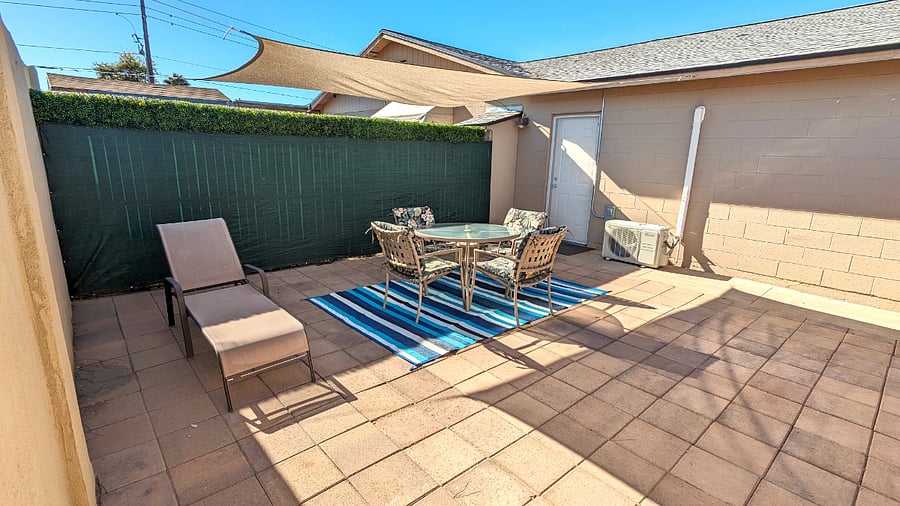 Private entry door between the outdoor lounge and unit.