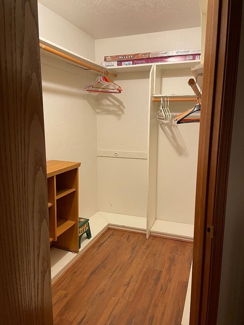 Large walk in closet and shelving for storage