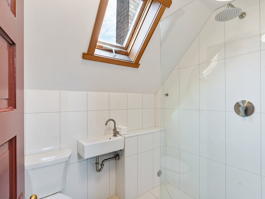 Newly remodeled bath with rain shower.