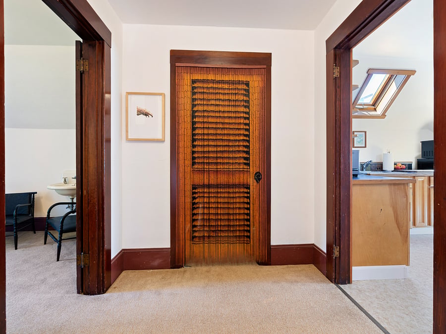 Landing at the top of the stairs, plus an extra closet