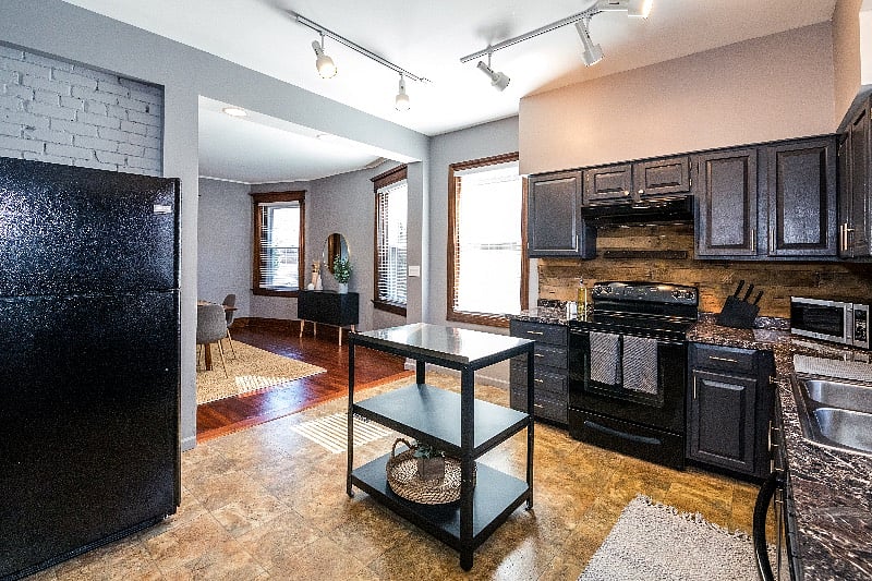 Entering through the back of the home will take you through the laundry room and kitchen.
