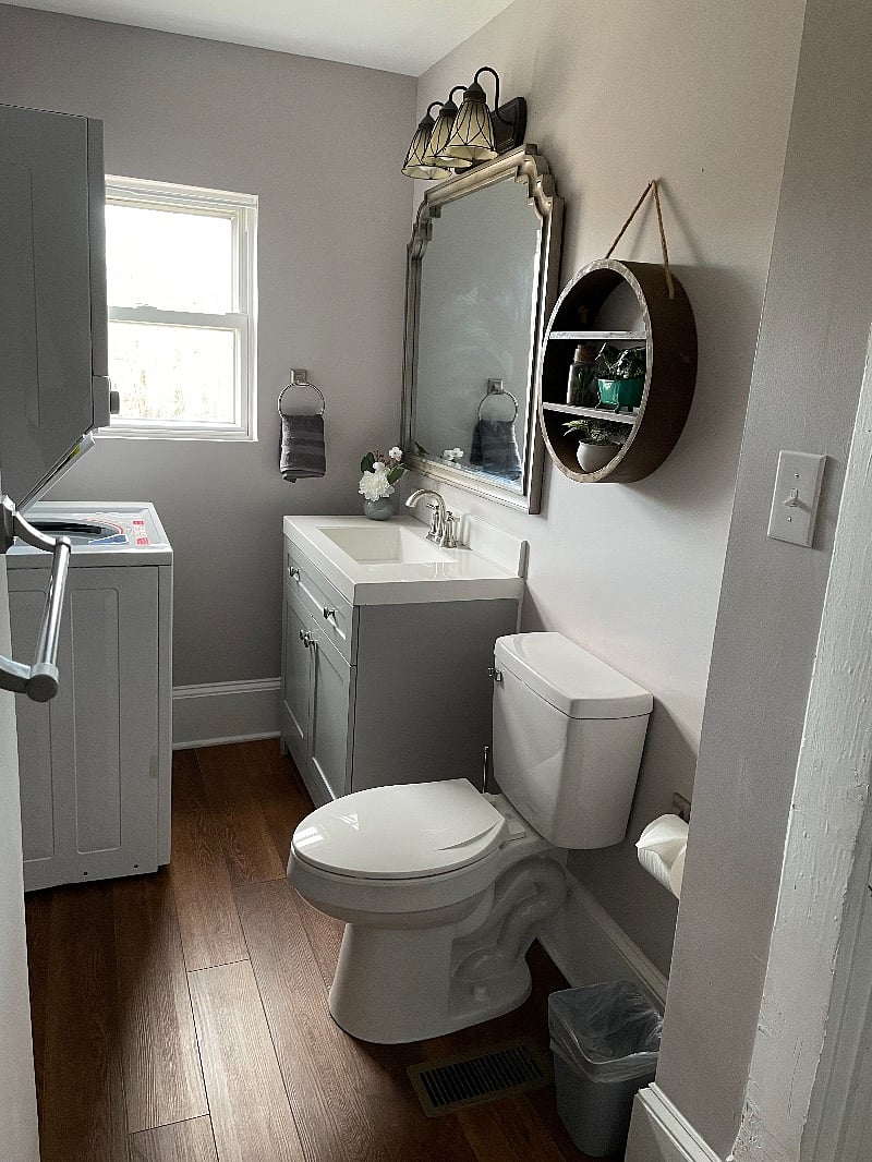 Bathroom with new stackable washer and dryer.