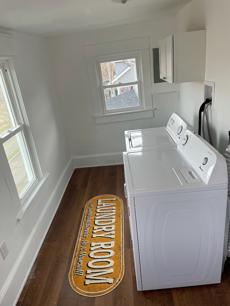 Laundry/office with brand new full size washer and dryer