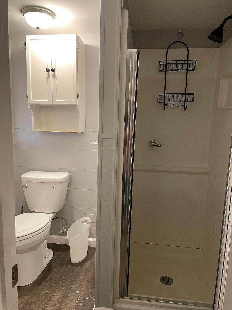 Small bathroom with stand up shower.