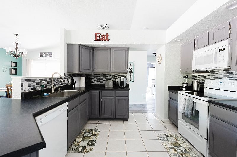 A different view of the full kitchen, peaking into the dining area on the left.