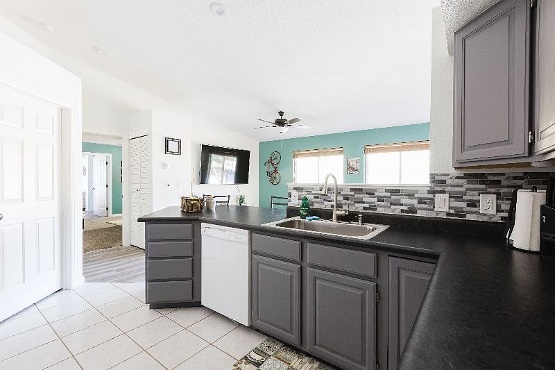 Plenty of prep space and bar stool area to enjoy snacks or a full meal.
