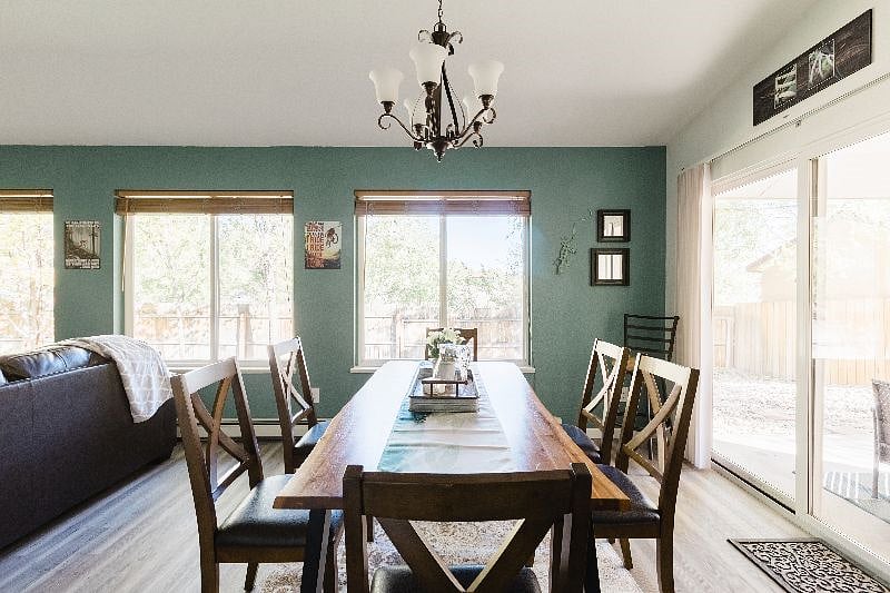 Whether you make the meal yourself or order in, enjoy this great dining area. The table is a beautiful, rustic 71 Acacia wood table with a metal frame. It's set up with 6 chairs, but you have 2 additional chairs, one in each of the bedrooms.