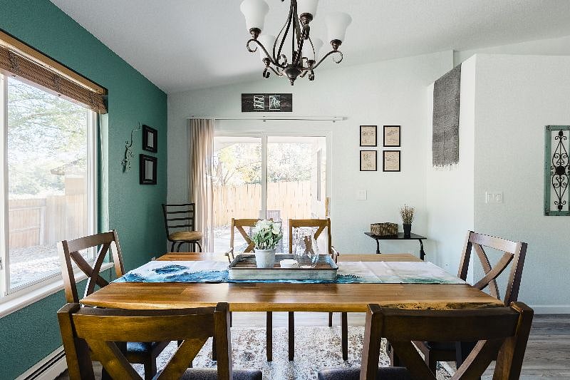 The dining area leads into the patio and the backyard.