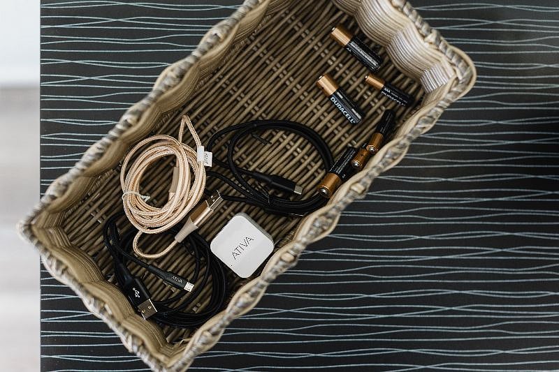 This basket has a few items you can borrow... like a phone charger should you forget yours.