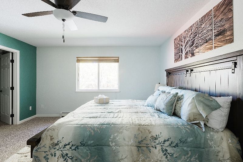 Another view of the master suite with its King size bed and walk-in closet.