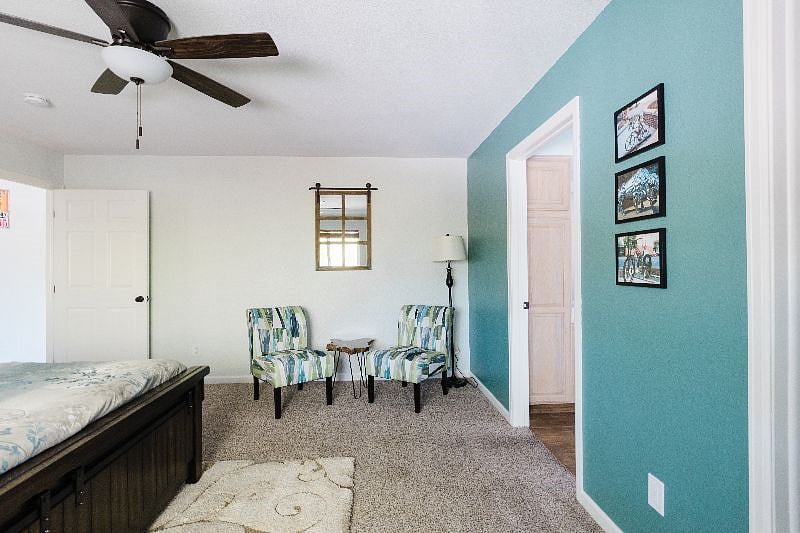 The master suite has its own seating area. Look at the pictures on the wall... more artwork from downtown for you to explore when you get here!