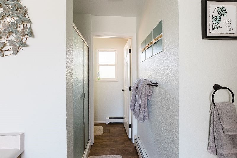 Shower and separate toilet room within the master bath.