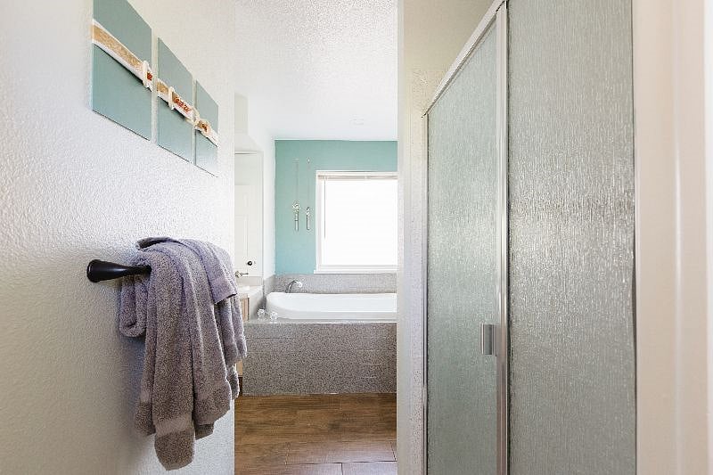 Full size shower and tub in the master bath.