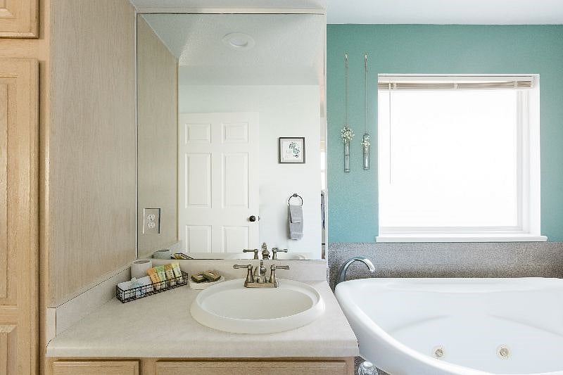 The master bath with two separate sinks, tub, and full size shower.