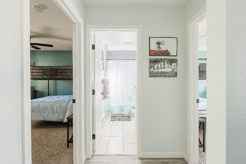 A view of the 2nd bathroom with the 2nd and 3rd bedrooms on either side.