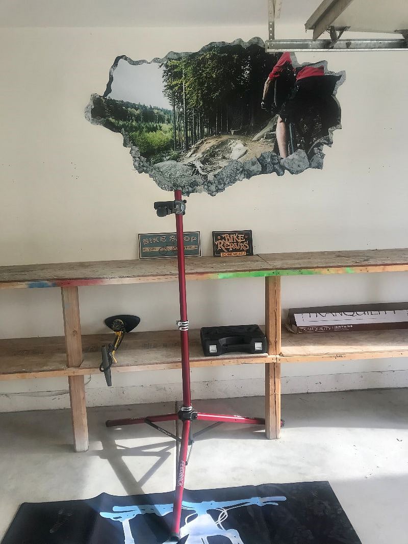 Heres the bike workstation in the garage with a stand, air pump, and tools. If you're visiting Grand Junction to go mountain biking, we make it easy for you to store and work on your bikes.