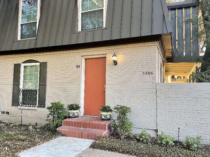 Front door of unit (orange door)