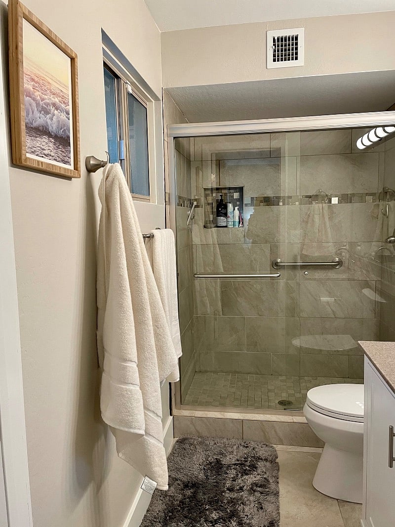 Tiled shower located in the primary en-suite bathroom.