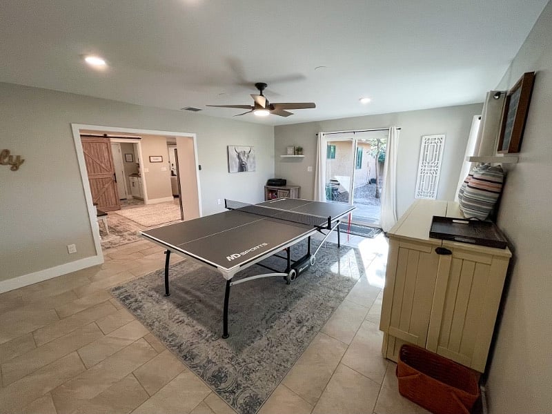 Ping pong table and Murphy bed are located in the game room.