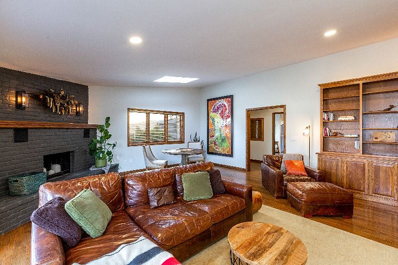 Living room is stocked with board games, books, and puzzles.