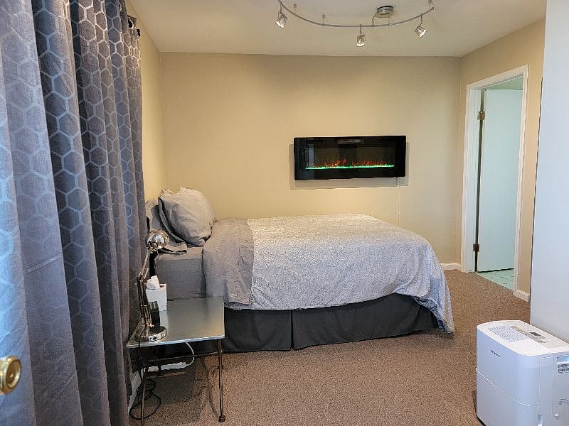 Indoor mood fireplace and blackout curtains in the bedroom